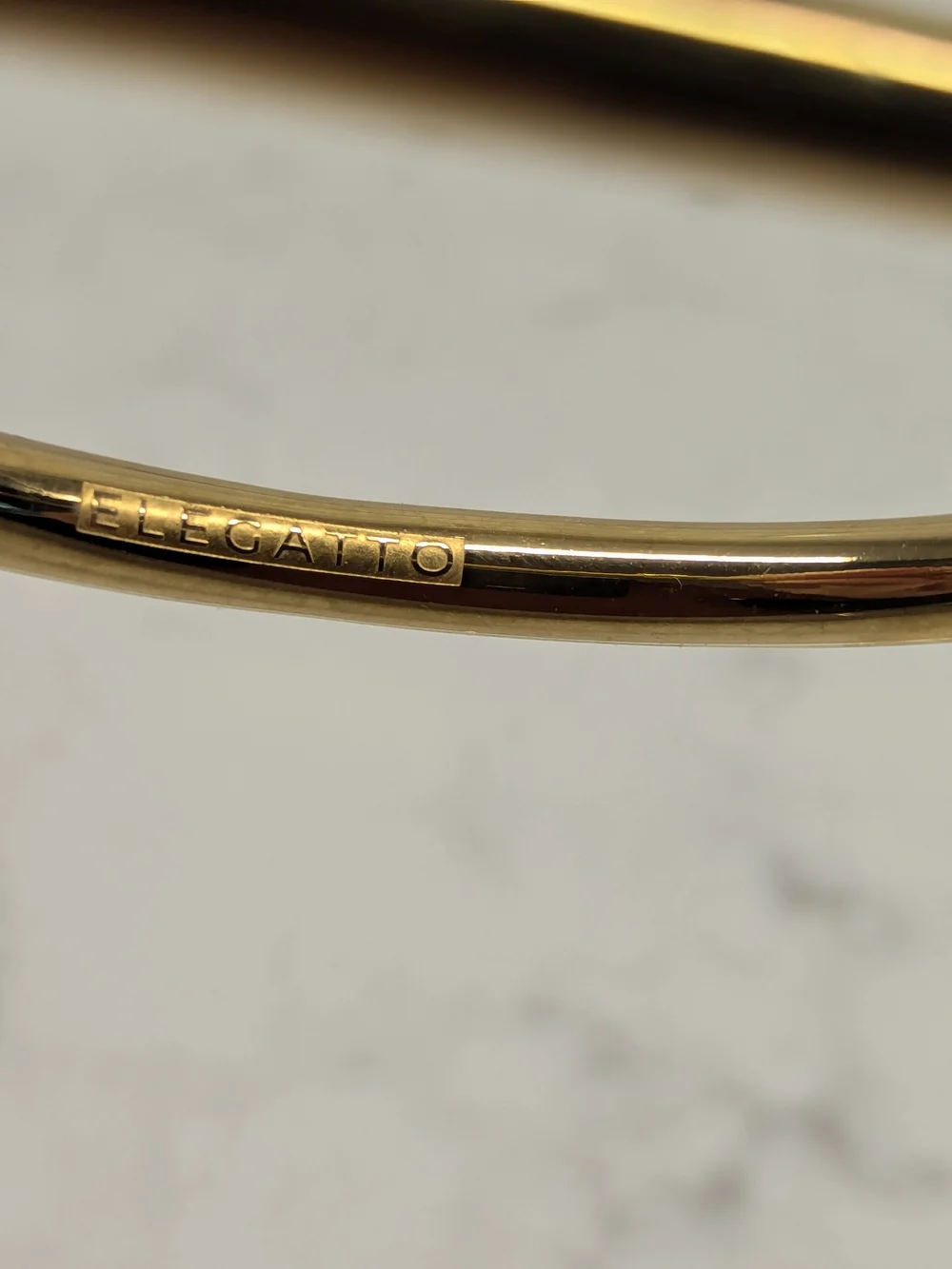 Elegatto Polished Gold Toned Bracelet